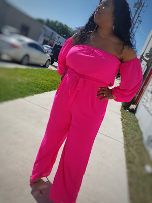 Haute NEON Pink jumpsuit.  Elastic bandeau designed with off the shoulder long sleeves attached.  Fully lined upper and bottom with a Chiffon overlay.